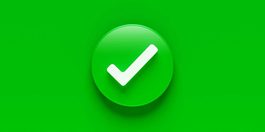 Green tick within a round button illuminated to portray a green flag in a relationship 